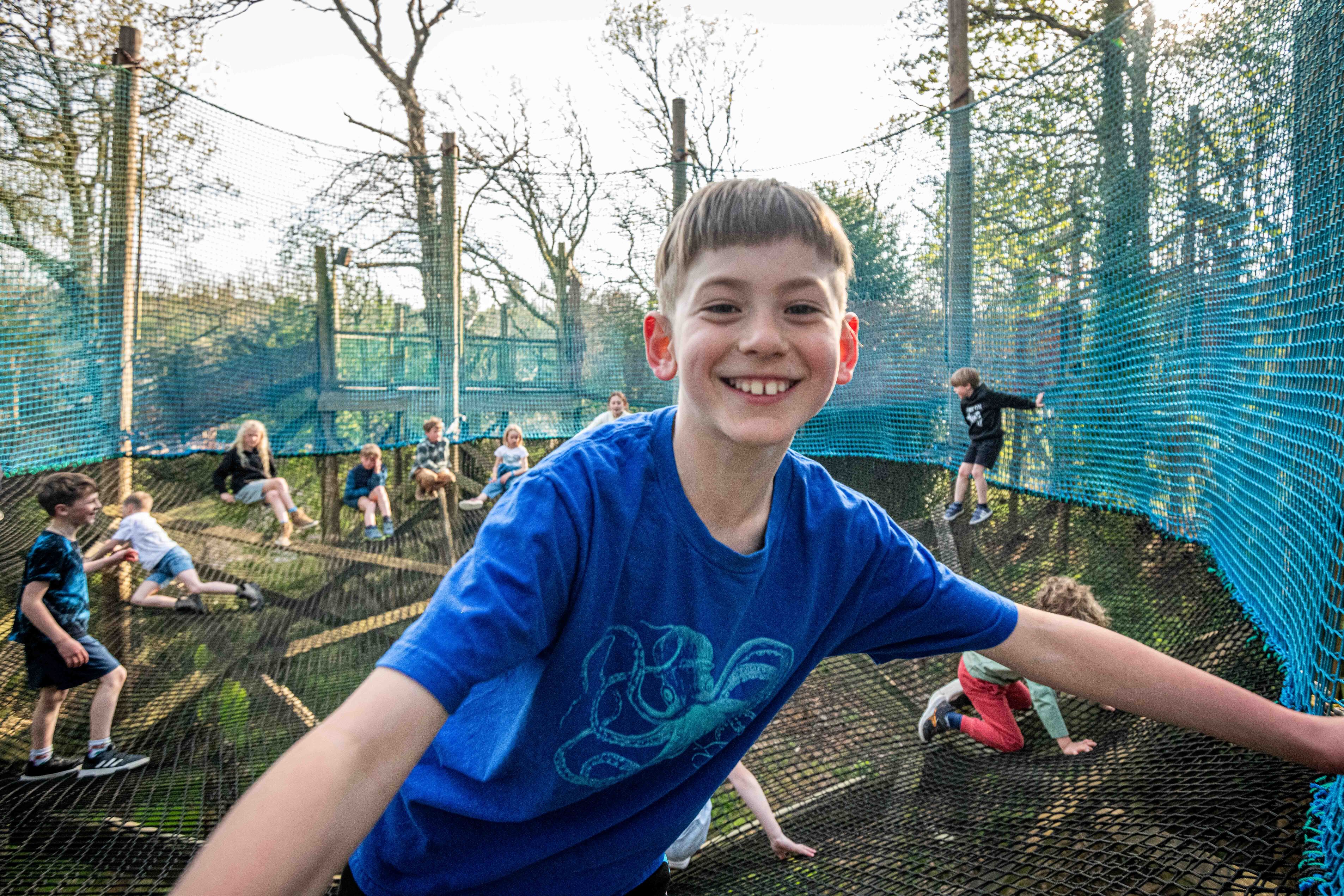 Boy Smiling on sky nets at Robin Hill Adventure Park