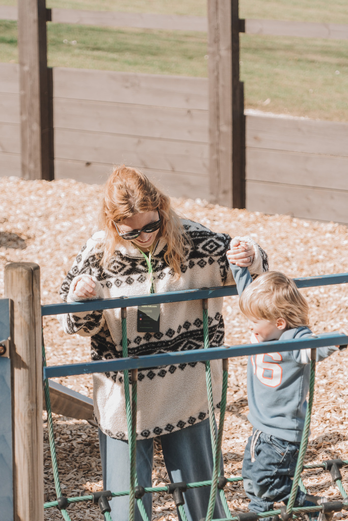 Mother and Son playing on baby play area