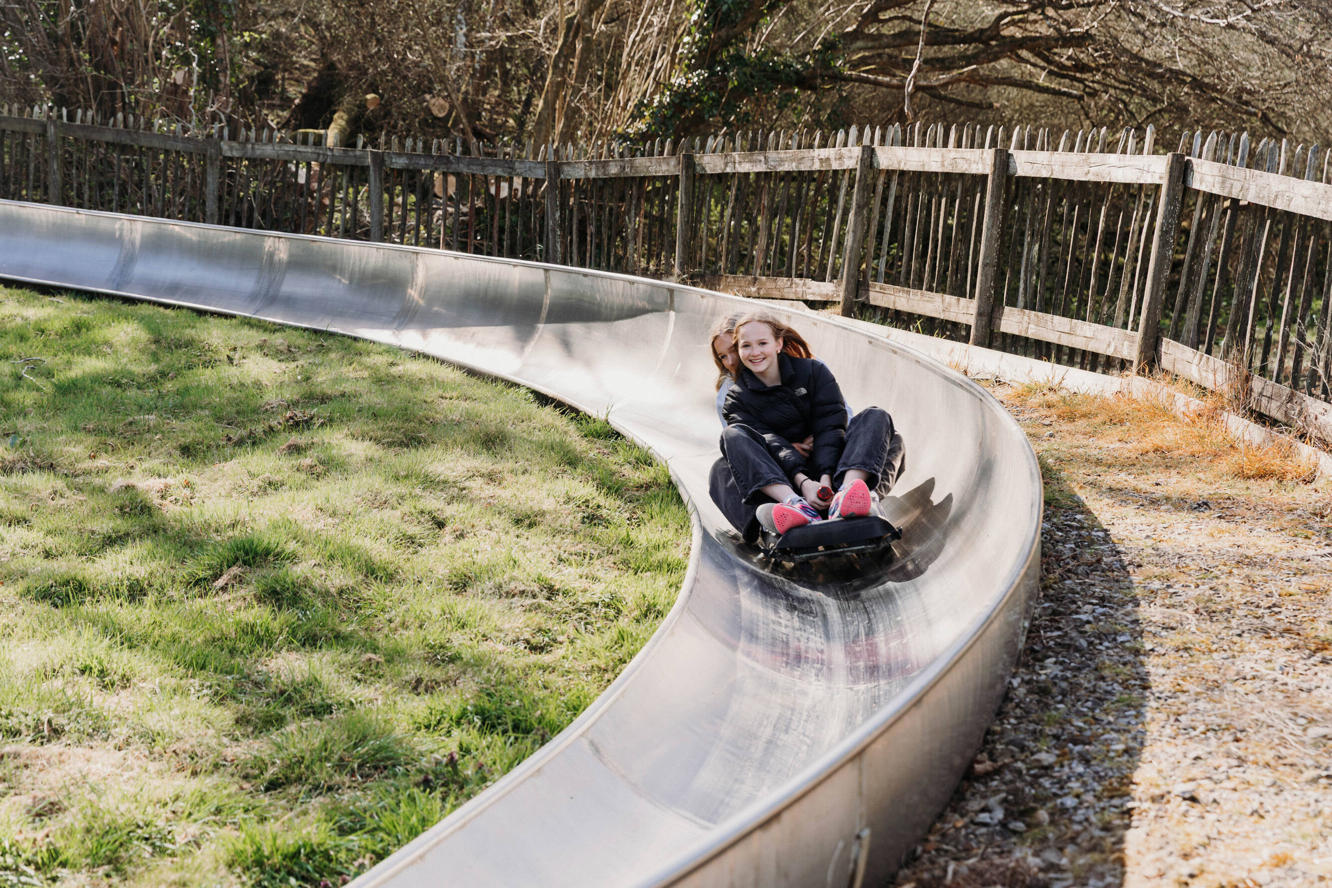 Teen girls on toboggan at Robin Hill Adventure Park