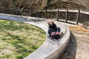 Teen girls on toboggan at Robin Hill Adventure Park