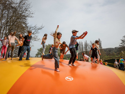 Children jumping on large bouncy pillow at Robin Hill Adventure Park