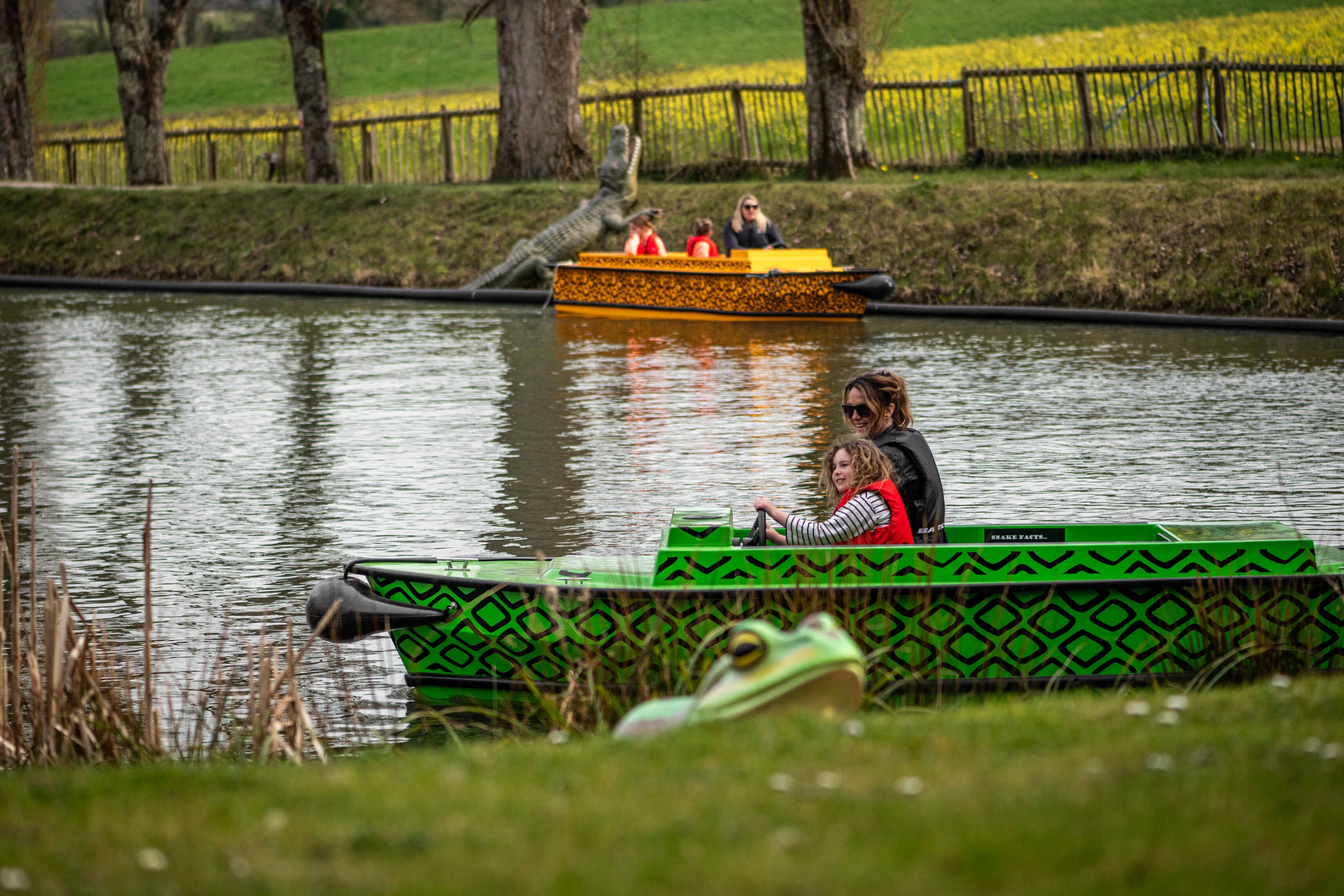 Mother and Daughter in toy electric boat