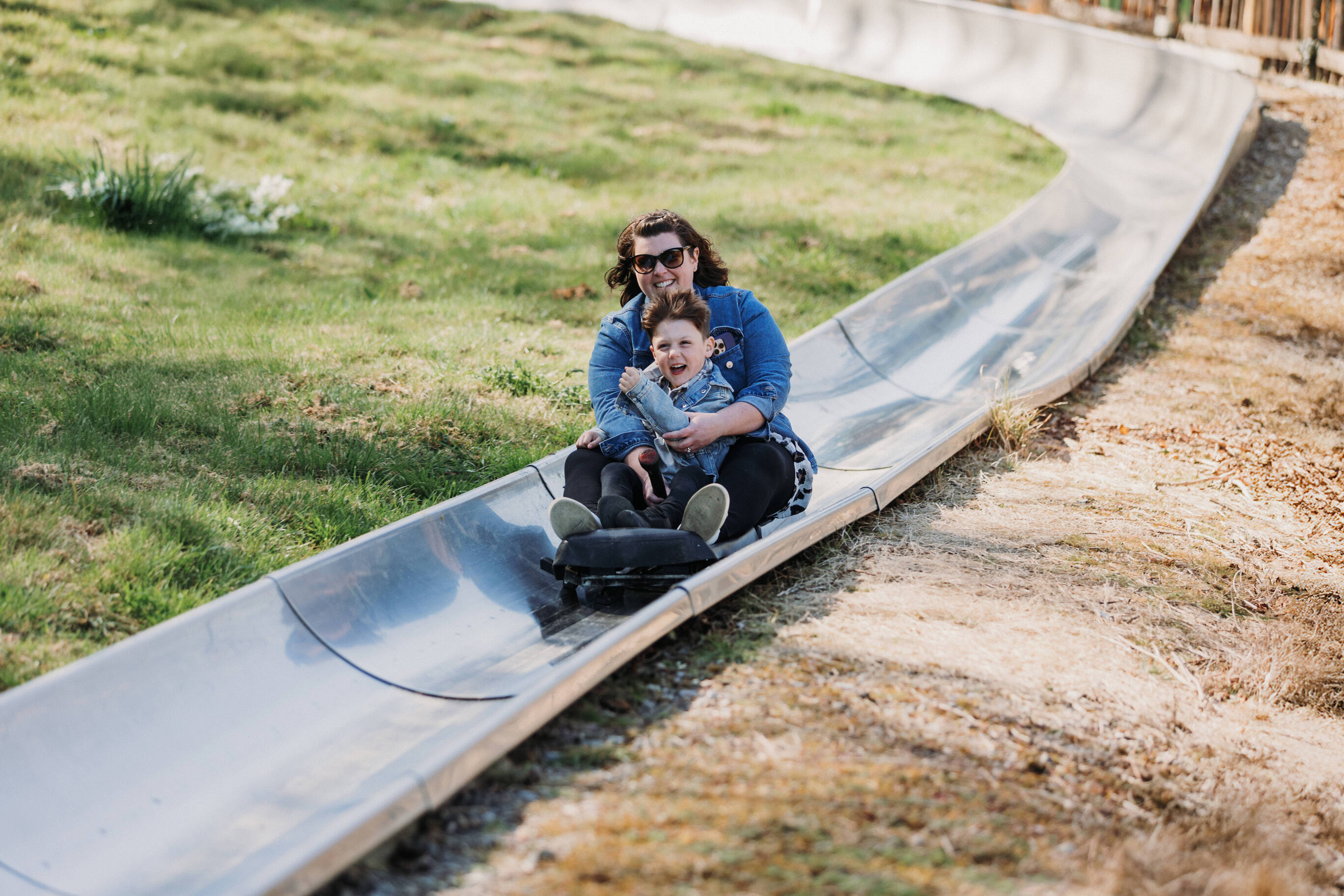 Mother and Son on toboggan at Robin Hill Adventure Park