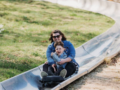 Mother and Son on toboggan at Robin Hill Adventure Park
