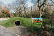 Picture of play tunnels with sign 'Tunnel Quest'