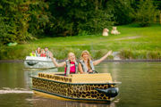 Two woman in safari themed electric boat